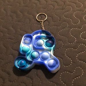 A among us keychain pop it’s blue with white so cute so fun and so cute nice pop